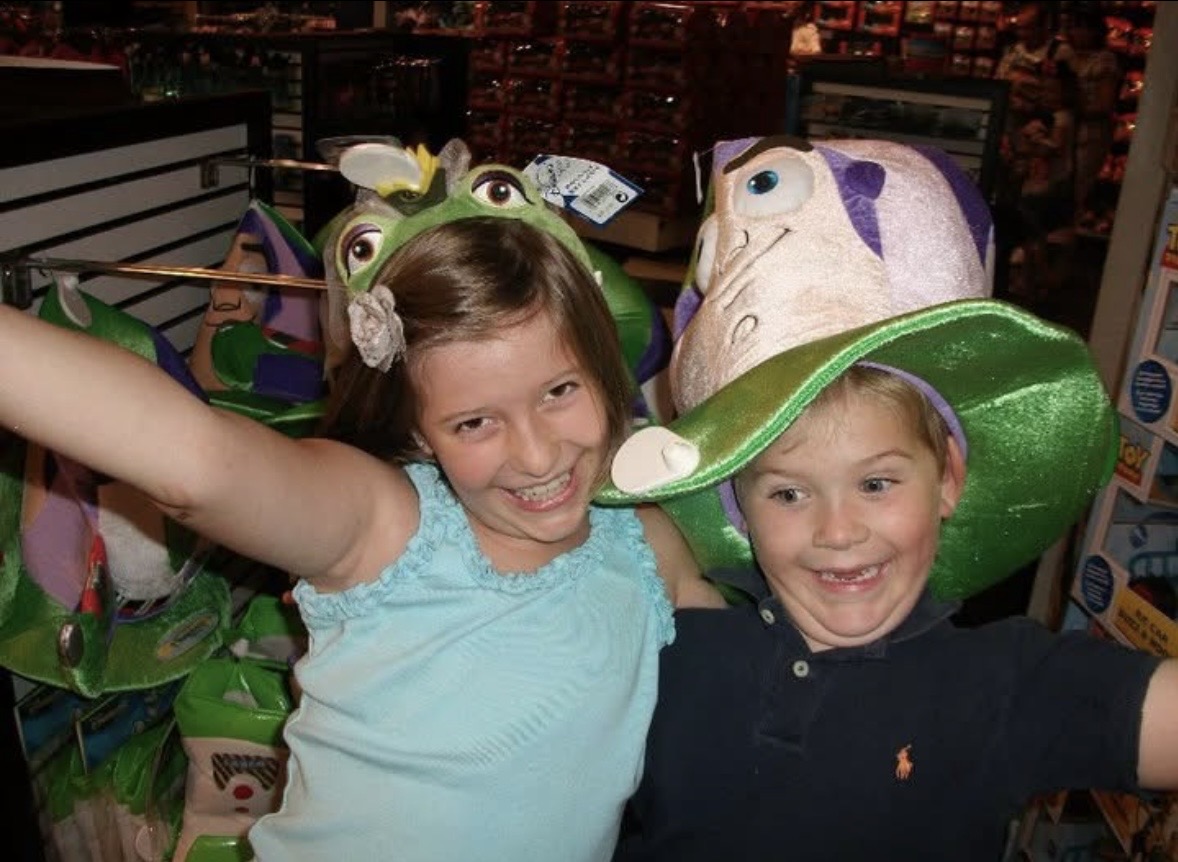 The kids trying on character hats